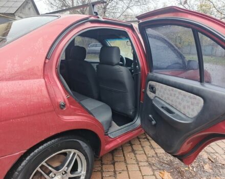 Червоний Ніссан Альмера, об'ємом двигуна 1.4 л та пробігом 3 тис. км за 1900 $, фото 4 на Automoto.ua