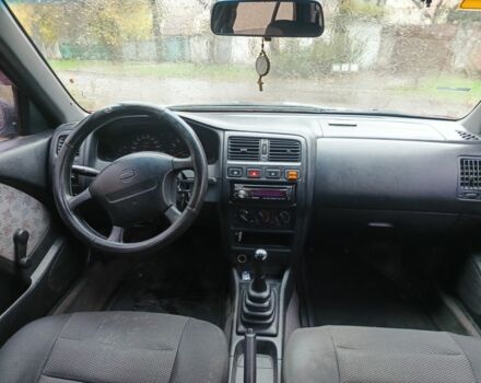 Червоний Ніссан Альмера, об'ємом двигуна 1.4 л та пробігом 3 тис. км за 1900 $, фото 2 на Automoto.ua