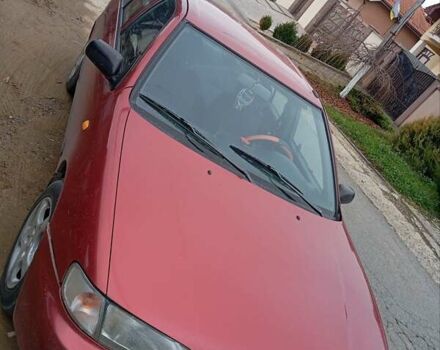 Красный Ниссан Альмера, объемом двигателя 1.4 л и пробегом 300 тыс. км за 1100 $, фото 1 на Automoto.ua