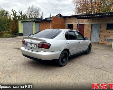 Серый Ниссан Альмера, объемом двигателя 2 л и пробегом 205 тыс. км за 2290 $, фото 2 на Automoto.ua