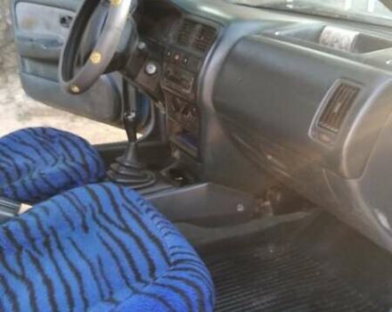 Синій Ніссан Альмера, об'ємом двигуна 1.4 л та пробігом 300 тис. км за 1500 $, фото 5 на Automoto.ua