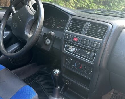 Синий Ниссан Альмера, объемом двигателя 1.4 л и пробегом 310 тыс. км за 1550 $, фото 5 на Automoto.ua