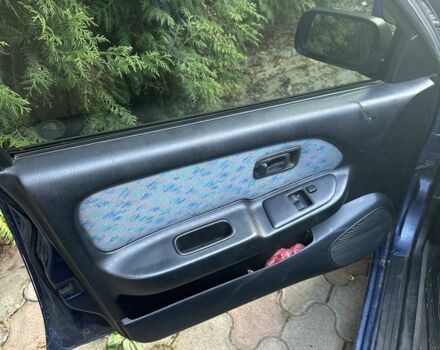 Синий Ниссан Альмера, объемом двигателя 1.4 л и пробегом 310 тыс. км за 1550 $, фото 7 на Automoto.ua