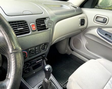 Синій Ніссан Альмера, об'ємом двигуна 1 л та пробігом 124 тис. км за 4250 $, фото 13 на Automoto.ua