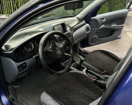 Синій Ніссан Альмера, об'ємом двигуна 1.5 л та пробігом 214 тис. км за 2599 $, фото 6 на Automoto.ua