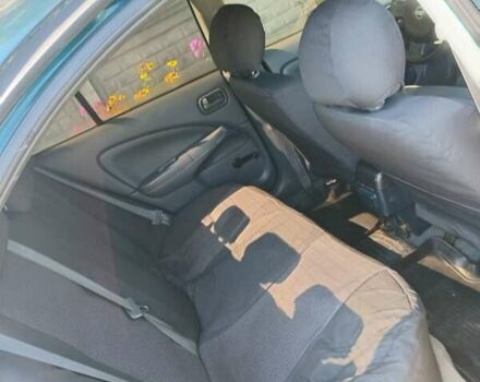 Синий Ниссан Альмера, объемом двигателя 1.6 л и пробегом 310 тыс. км за 3300 $, фото 7 на Automoto.ua