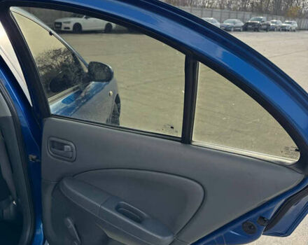 Синій Ніссан Альмера, об'ємом двигуна 1.6 л та пробігом 200 тис. км за 3899 $, фото 14 на Automoto.ua