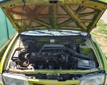 Зелений Ніссан Альмера, об'ємом двигуна 1.4 л та пробігом 150 тис. км за 1800 $, фото 4 на Automoto.ua