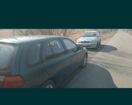 Зеленый Ниссан Альмера, объемом двигателя 1.4 л и пробегом 200 тыс. км за 971 $, фото 1 на Automoto.ua