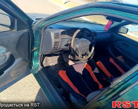 Зелений Ніссан Альмера, об'ємом двигуна 1.4 л та пробігом 400 тис. км за 2200 $, фото 5 на Automoto.ua