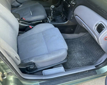 Зеленый Ниссан Альмера, объемом двигателя 1.46 л и пробегом 369 тыс. км за 3000 $, фото 7 на Automoto.ua