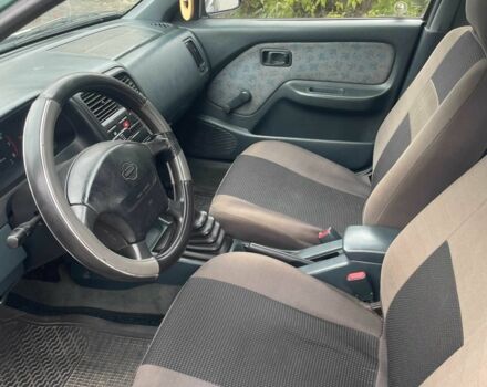 Зеленый Ниссан Альмера, объемом двигателя 1.4 л и пробегом 234 тыс. км за 1900 $, фото 9 на Automoto.ua