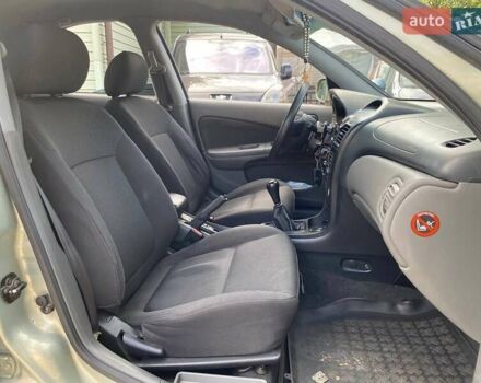 Зелений Ніссан Альмера, об'ємом двигуна 1.6 л та пробігом 75 тис. км за 5990 $, фото 11 на Automoto.ua