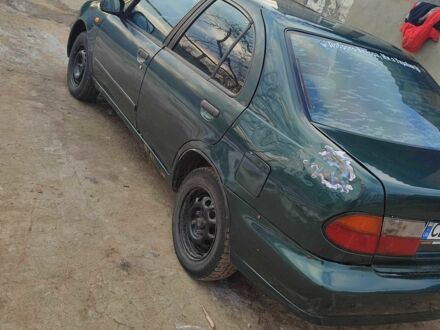 Зелений Ніссан Альмера, об'ємом двигуна 1.4 л та пробігом 100 тис. км за 1000 $, фото 1 на Automoto.ua