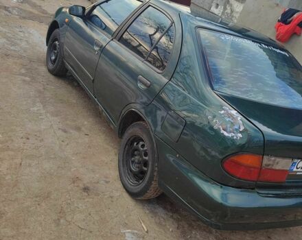 Зеленый Ниссан Альмера, объемом двигателя 1.4 л и пробегом 100 тыс. км за 1000 $, фото 1 на Automoto.ua