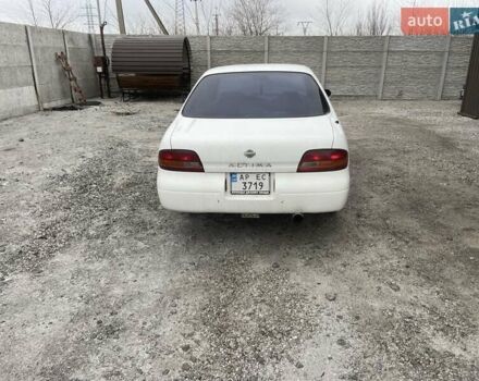 Белый Ниссан Альтима, объемом двигателя 2 л и пробегом 234 тыс. км за 1800 $, фото 1 на Automoto.ua