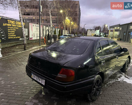Черный Ниссан Альтима, объемом двигателя 2.4 л и пробегом 197 тыс. км за 3000 $, фото 2 на Automoto.ua