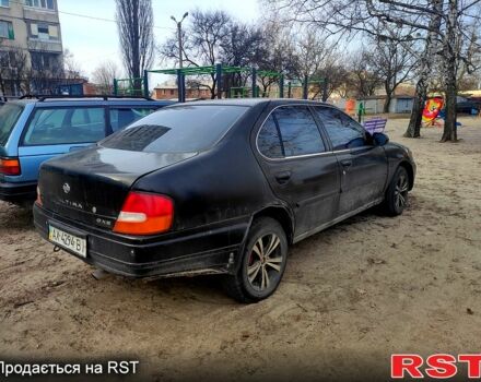 Чорний Ніссан Альтіма, об'ємом двигуна 2.4 л та пробігом 320 тис. км за 1900 $, фото 3 на Automoto.ua