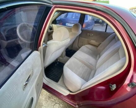 Красный Ниссан Альтима, объемом двигателя 2.4 л и пробегом 200 тыс. км за 1850 $, фото 5 на Automoto.ua