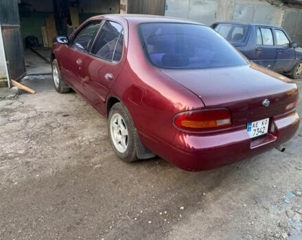 Красный Ниссан Альтима, объемом двигателя 2.4 л и пробегом 200 тыс. км за 1850 $, фото 3 на Automoto.ua
