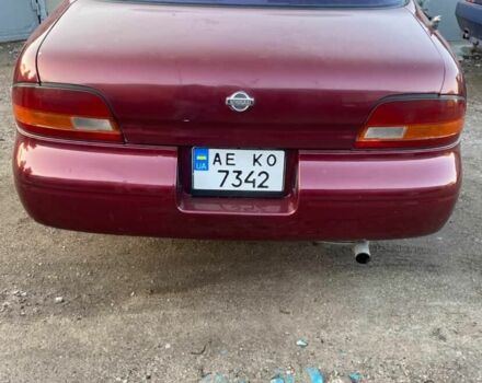 Красный Ниссан Альтима, объемом двигателя 2.4 л и пробегом 200 тыс. км за 1850 $, фото 2 на Automoto.ua
