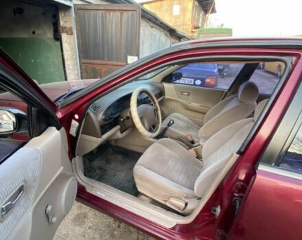 Красный Ниссан Альтима, объемом двигателя 2.4 л и пробегом 200 тыс. км за 1850 $, фото 4 на Automoto.ua