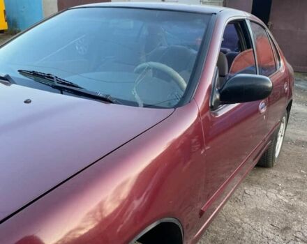 Красный Ниссан Альтима, объемом двигателя 2.4 л и пробегом 200 тыс. км за 1850 $, фото 1 на Automoto.ua