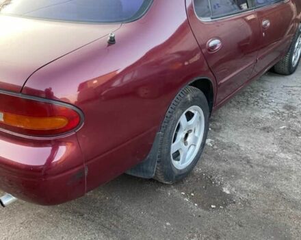 Красный Ниссан Альтима, объемом двигателя 2.4 л и пробегом 200 тыс. км за 1850 $, фото 10 на Automoto.ua