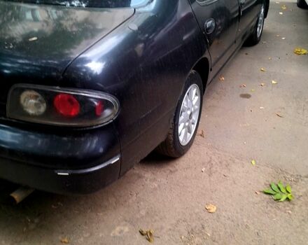 Сірий Ніссан Альтіма, об'ємом двигуна 2.4 л та пробігом 240 тис. км за 1100 $, фото 5 на Automoto.ua