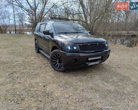 Черный Ниссан Армада, объемом двигателя 5.6 л и пробегом 255 тыс. км за 8000 $, фото 2 на Automoto.ua