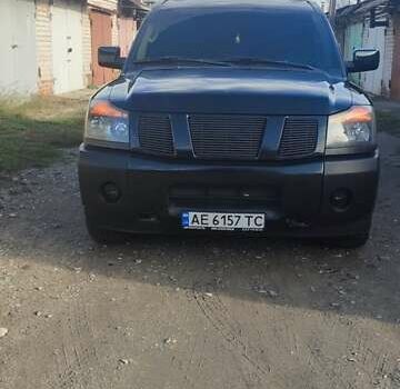 Черный Ниссан Армада, объемом двигателя 5.6 л и пробегом 300 тыс. км за 8500 $, фото 1 на Automoto.ua