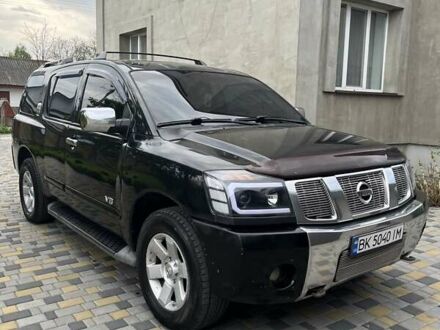 Черный Ниссан Армада, объемом двигателя 5.6 л и пробегом 255 тыс. км за 9000 $, фото 1 на Automoto.ua