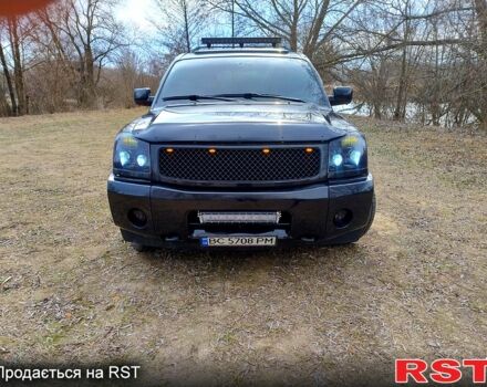 Черный Ниссан Армада, объемом двигателя 5.6 л и пробегом 255 тыс. км за 8000 $, фото 1 на Automoto.ua