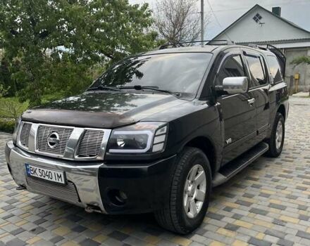 Чорний Ніссан Armada, об'ємом двигуна 5.6 л та пробігом 244 тис. км за 10999 $, фото 1 на Automoto.ua