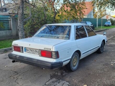 Белый Ниссан Блюберд, объемом двигателя 2 л и пробегом 300 тыс. км за 650 $, фото 1 на Automoto.ua