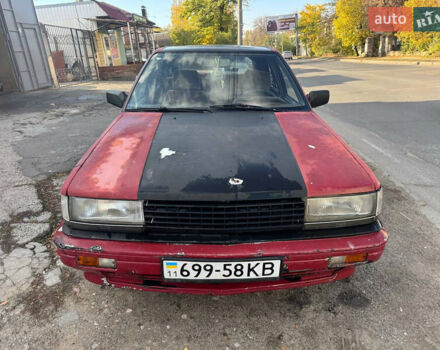 Красный Ниссан Блюберд, объемом двигателя 2 л и пробегом 300 тыс. км за 550 $, фото 2 на Automoto.ua