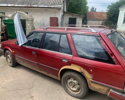 Красный Ниссан Блюберд, объемом двигателя 2 л и пробегом 300 тыс. км за 409 $, фото 1 на Automoto.ua