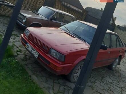 Красный Ниссан Блюберд, объемом двигателя 2 л и пробегом 315 тыс. км за 1450 $, фото 1 на Automoto.ua