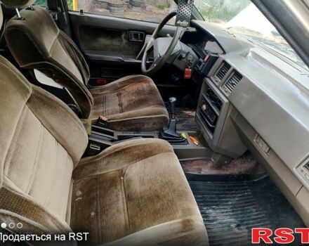 Серый Ниссан Блюберд, объемом двигателя 2 л и пробегом 250 тыс. км за 650 $, фото 4 на Automoto.ua