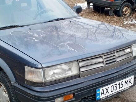 Синий Ниссан Блюберд, объемом двигателя 2 л и пробегом 220 тыс. км за 700 $, фото 1 на Automoto.ua