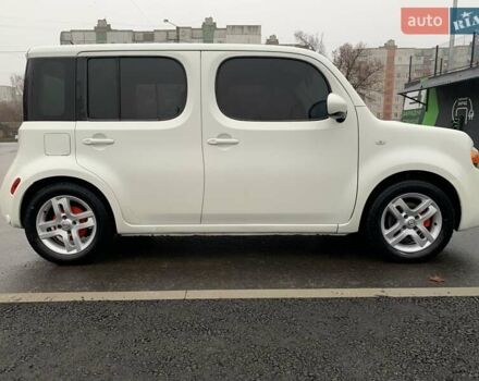 Белый Ниссан Куб, объемом двигателя 1.8 л и пробегом 195 тыс. км за 6000 $, фото 2 на Automoto.ua