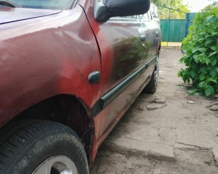 Красный Ниссан Другая, объемом двигателя 1.6 л и пробегом 328 тыс. км за 1700 $, фото 5 на Automoto.ua