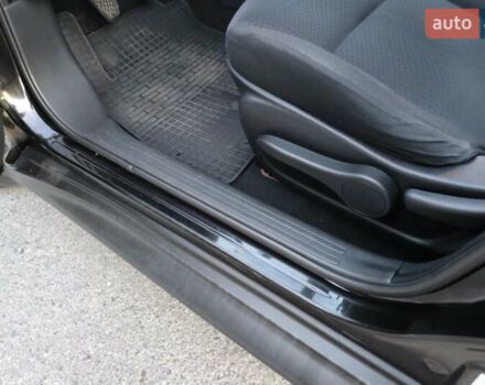 Черный Ниссан Жук, объемом двигателя 1.6 л и пробегом 153 тыс. км за 9500 $, фото 7 на Automoto.ua