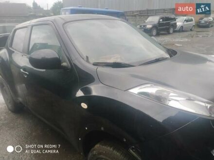 Черный Ниссан Жук, объемом двигателя 1.6 л и пробегом 200 тыс. км за 5000 $, фото 1 на Automoto.ua