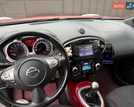 Червоний Ніссан Жук, об'ємом двигуна 1.6 л та пробігом 211 тис. км за 10500 $, фото 6 на Automoto.ua