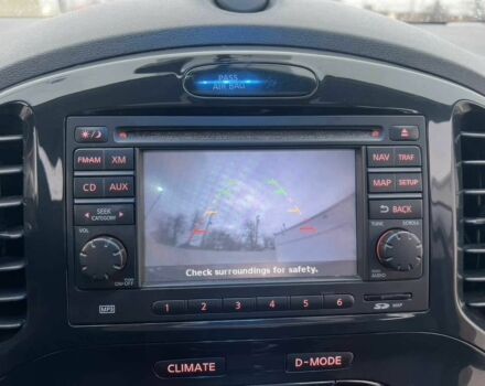 Червоний Ніссан Жук, об'ємом двигуна 1.6 л та пробігом 80 тис. км за 12600 $, фото 10 на Automoto.ua