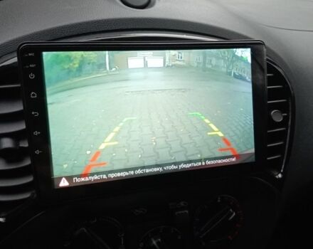 Красный Ниссан Жук, объемом двигателя 2 л и пробегом 126 тыс. км за 8900 $, фото 6 на Automoto.ua