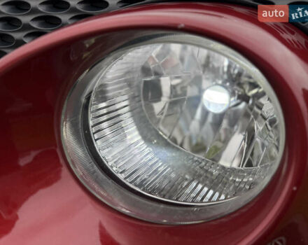 Червоний Ніссан Жук, об'ємом двигуна 1.6 л та пробігом 151 тис. км за 9900 $, фото 7 на Automoto.ua
