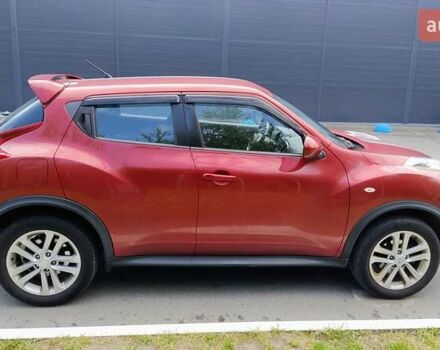 Червоний Ніссан Жук, об'ємом двигуна 1.6 л та пробігом 114 тис. км за 11000 $, фото 4 на Automoto.ua