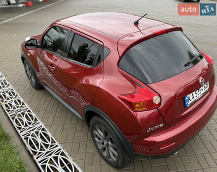 Червоний Ніссан Жук, об'ємом двигуна 1.6 л та пробігом 151 тис. км за 9900 $, фото 6 на Automoto.ua